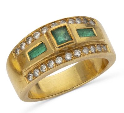 an emerald and diamond band ring