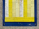 a sign on the side of a building that has a list of bus routes