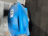a blue blow dryer sitting on the steps of a building