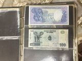 two different bills in a wallet on a table