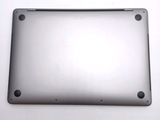 a close up of a silver laptop computer on a white surface