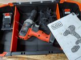 an orange and black cordless drill and two batteries in a case