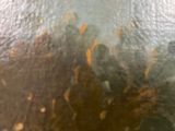 a close up view of a metal surface with rust on it