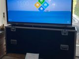 a large flat screen tv sitting on a stand in a living room