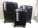 three pieces of luggage that are sitting on a table