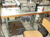 a sewing machine that is sitting in the middle of a room