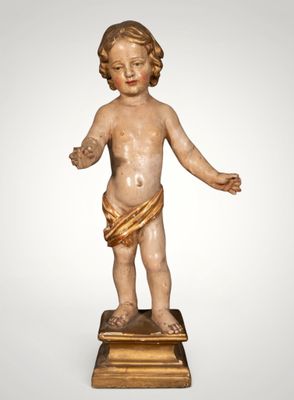 an image of a statue of a child with a bow around his waist