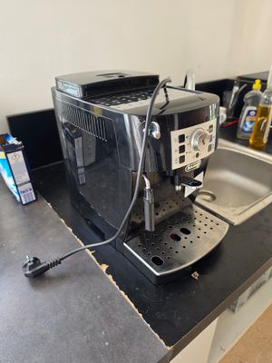 an image of a coffee machine sitting on a kitchen counter