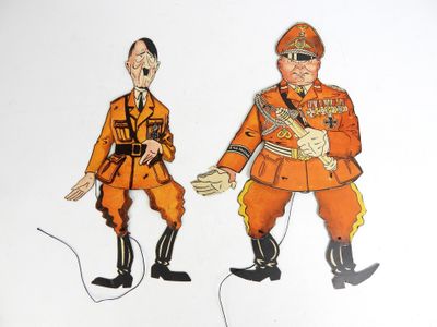 deux silhouettes en papier représentant un homme et une femme en uniforme