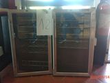two wine coolers that are on display in a store