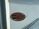 a sign on the door of a car that says,