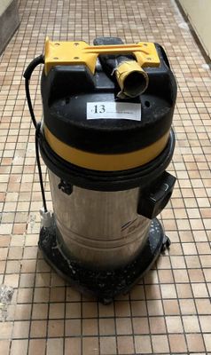 a vacuum that is sitting on the floor in the hallway