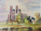 a watercolor painting of a church on a hill by the water