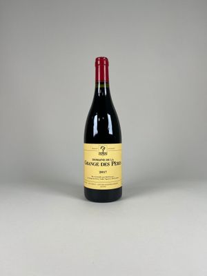 a bottle of red wine sitting on top of a table
