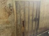 a dirty bathroom with a toilet and a sink in it
