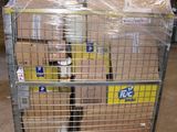 a cart with a bunch of boxes on it in a warehouse