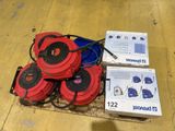 several red and blue speakers are sitting on top of a cardboard box