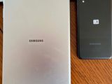 a picture of a picture of a man on the phone next to a samsung tablet