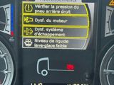 a car dashboard with a lot of information on it