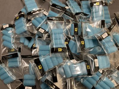a pile of blue and black medical gauzes on a table