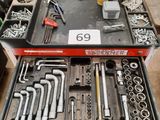 many tools in a tool box on the floor