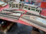 a table that has a bunch of model trains on it