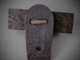a wooden door with a metal latch on it