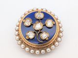 an image of a blue and gold broochle with pearls on it