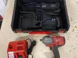 an image of a corded drill and a tool box on a table