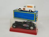 a toy truck and a toy car on top of each other