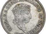 gros plan d'une pièce de monnaie sur laquelle figure une tête de femme