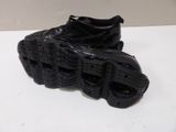 a black shoe that is on top of a table