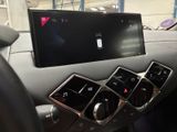a picture of a car dashboard with a laptop on it