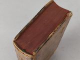 a small book sitting on top of a white table