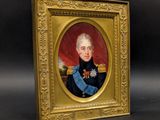 portrait of a man in a blue uniform in a gold frame