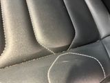 a close up of a car seat with stitching on it