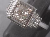 an image of a diamond ring on a ring stand