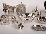 a lot of silver items that are on the table