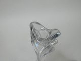 a glass vase that is sitting on a table