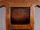a close up of a wooden chair with writing on the back