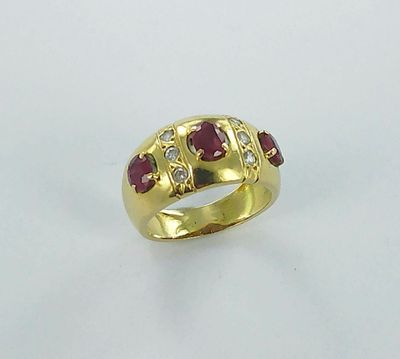an image of a gold ring with rubies and diamonds