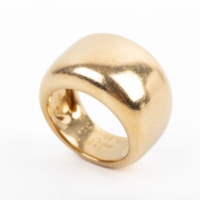 a close up of a gold ring on a white background