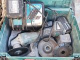 a green box with tools in it on the ground