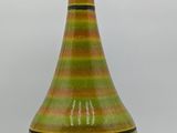 an image of a table lamp with a green and black design