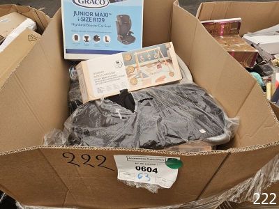 a cardboard box full of items for sale on the street