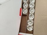 a cardboard box with a bunch of white buttons in it