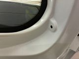 a close up of a car door with a window open