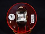 a watch that is sitting on top of a red plate