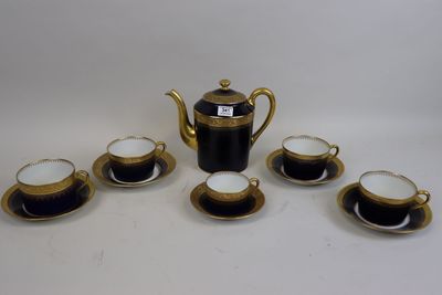 five cups and a teapot on the table