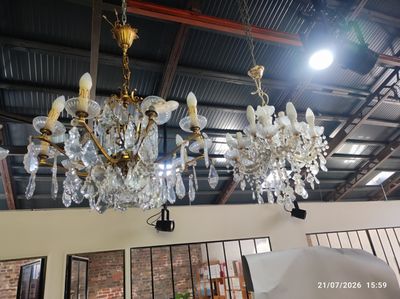 a chandelier hanging from the ceiling in a room